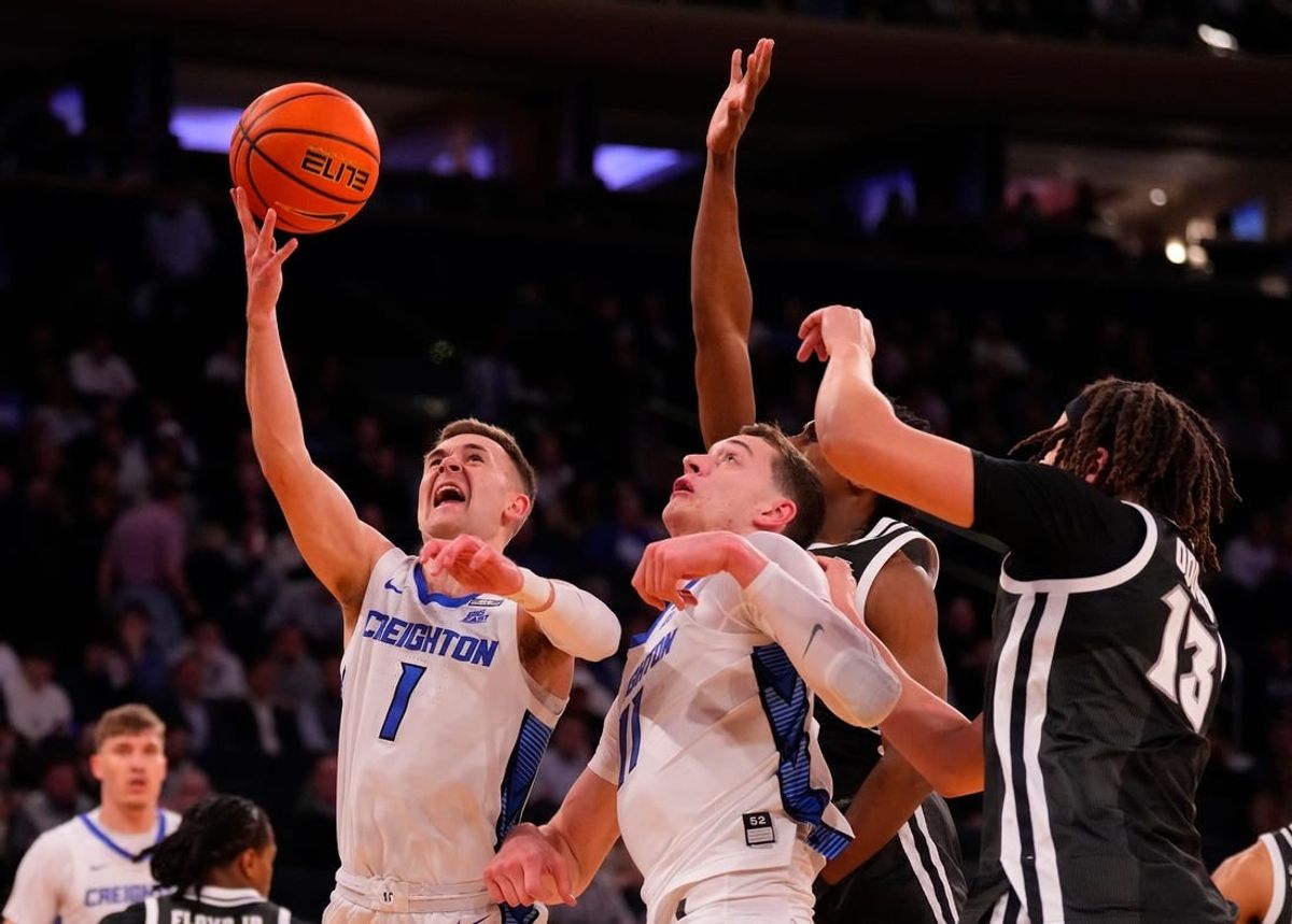 Mar 14, 2024; New York City, NY, USA;  Creighton Bluejays guard Steven Ashworth (1) shoots over the Providence Friars defense during the first half at Madison Square Garden.