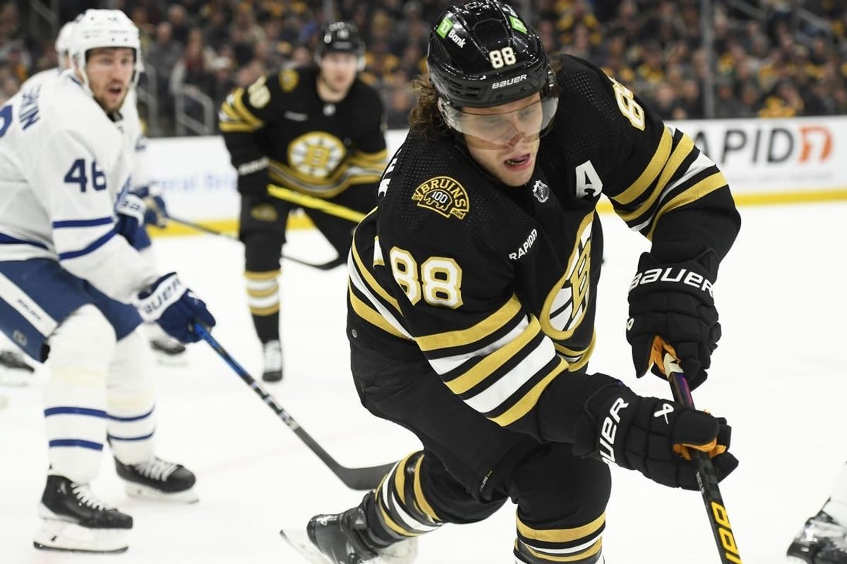 Apr 20, 2024; Boston, Massachusetts, USA; Boston Bruins right wing David Pastrnak (88) chases the puck in the corner during the first period in game one of the first round of the 2024 Stanley Cup Playoffs against the Toronto Maple Leafs at TD Garden.
