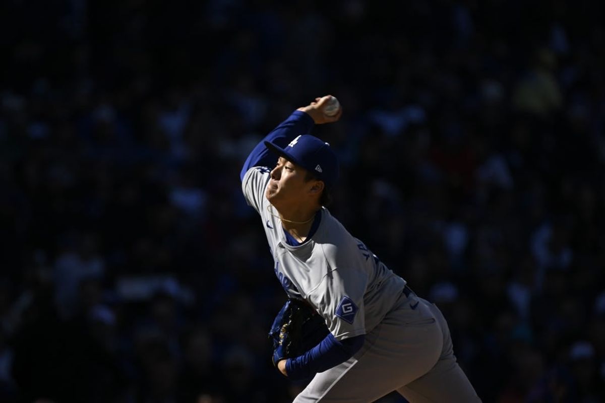 Apr 6, 2024; Chicago, Illinois, USA;  Los Angeles Dodgers pitcher Yoshinobu Yamamoto (18) delivers against the Chicago Cubs during the first inning at Wrigley Field.