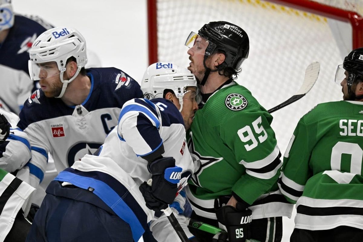 Apr 11, 2024; Dallas, Texas, USA; Winnipeg Jets defenseman Brenden Dillon (5) collides with Dallas Stars center Matt Duchene (95) in the Jets crease during the second period at the American Airlines Center.