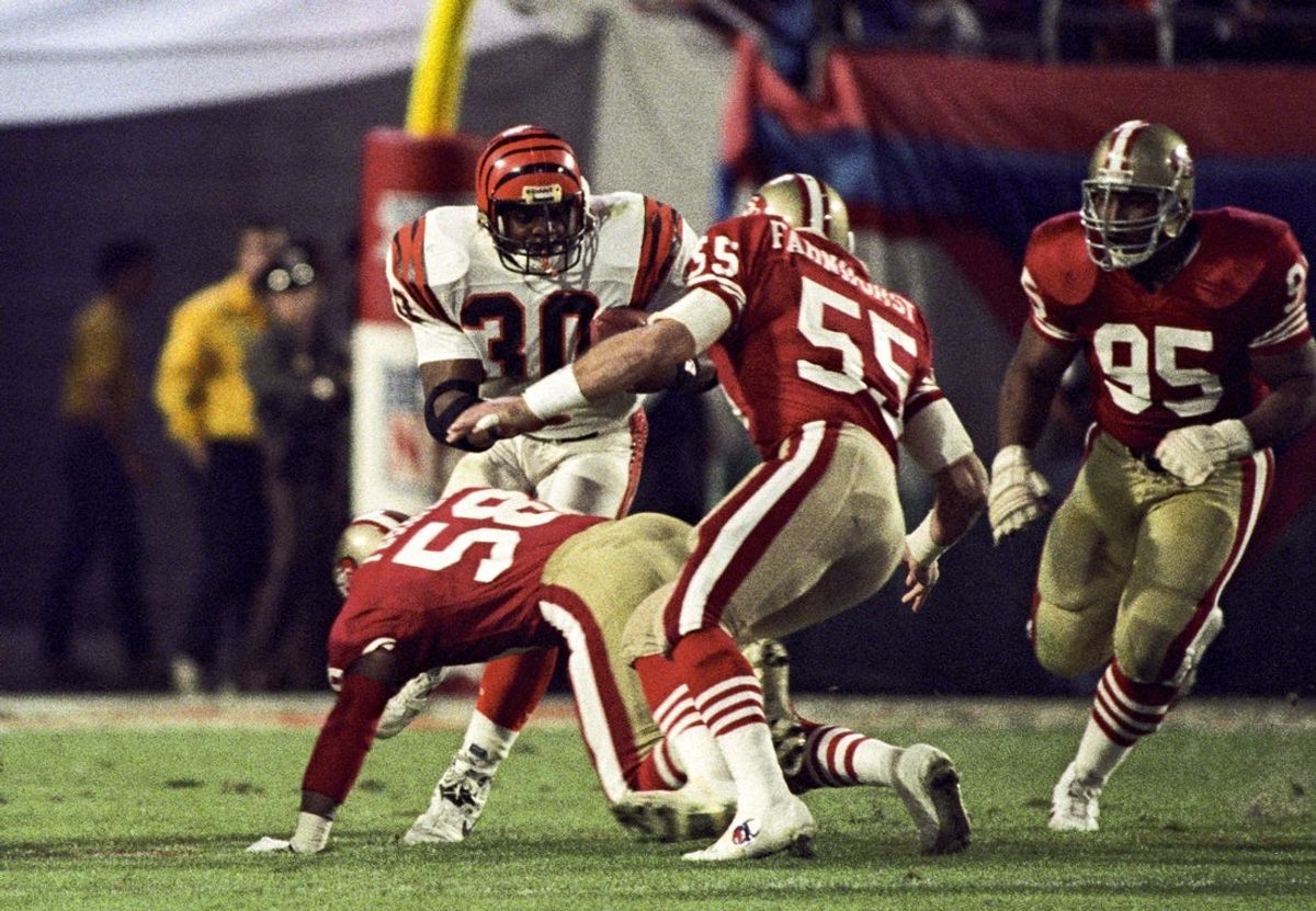Jan 22, 1989; Miami, FL, USA; FILE PHOTO; San Francisco 49ers linebacker Keena Turner (58), linebacker Jim Fahnhorst (55), and nose tackle Michael Carter (95) look to tackle Cincinnati Bengals running back Ickey Woods (30) during Super Bowl XXIII at Joe Robbie Stadium. The 49ers defeated the Bengals 20-16. Mandatory Credit: Bob Deutsch-Imagn Images
