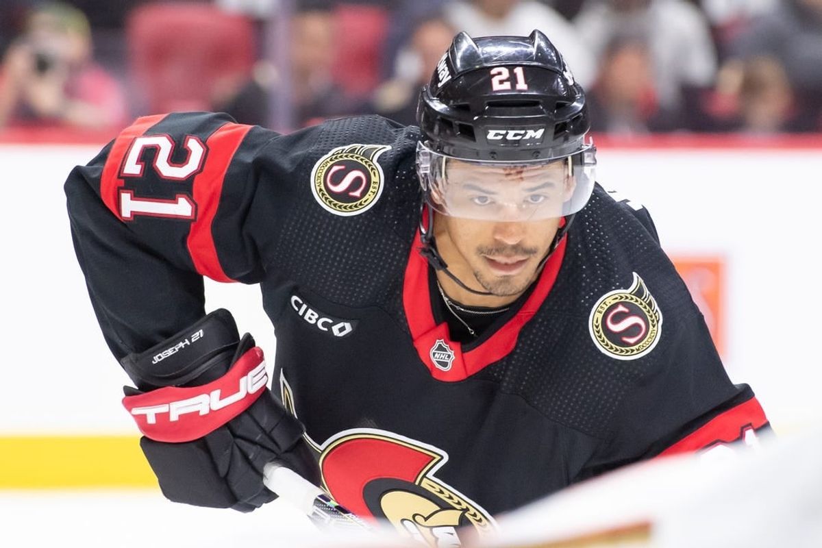 Feb 15, 2024; Ottawa, Ontario, CAN; Ottawa Senators right wing Mathieu Joseph (21) sets up for a face off in the first period  against the Anaheim Ducks at the Canadian Tire Centre.