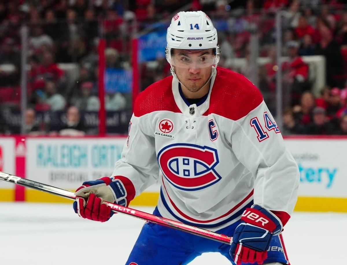 Dec 28, 2023; Raleigh, North Carolina, USA; Montreal Canadiens center Nick Suzuki (14) watches the play against the Carolina Hurricanes during the second period at PNC Arena.