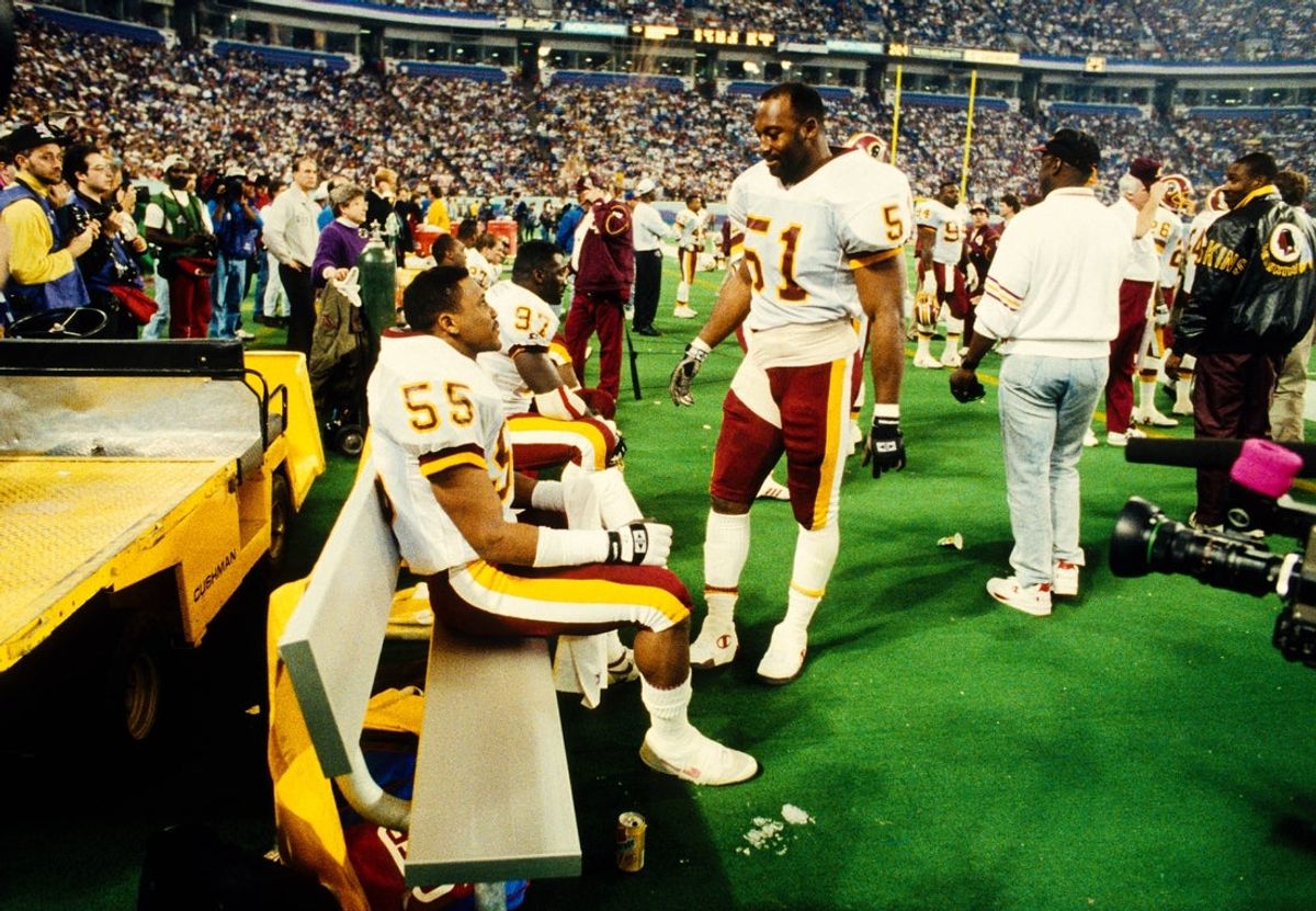 Jan 26, 1992; Minneapolis, MN, USA; FILE PHOTO; Washington Redskins linebacker Monte Coleman (51) and linebacker Andre Collins (55) on the sideline during Super Bowl XXVI against the Buffalo Bills at the Metrodome. The Redskins defeated the Bills 37-24. Mandatory Credit: RVR Photos-Imagn Images