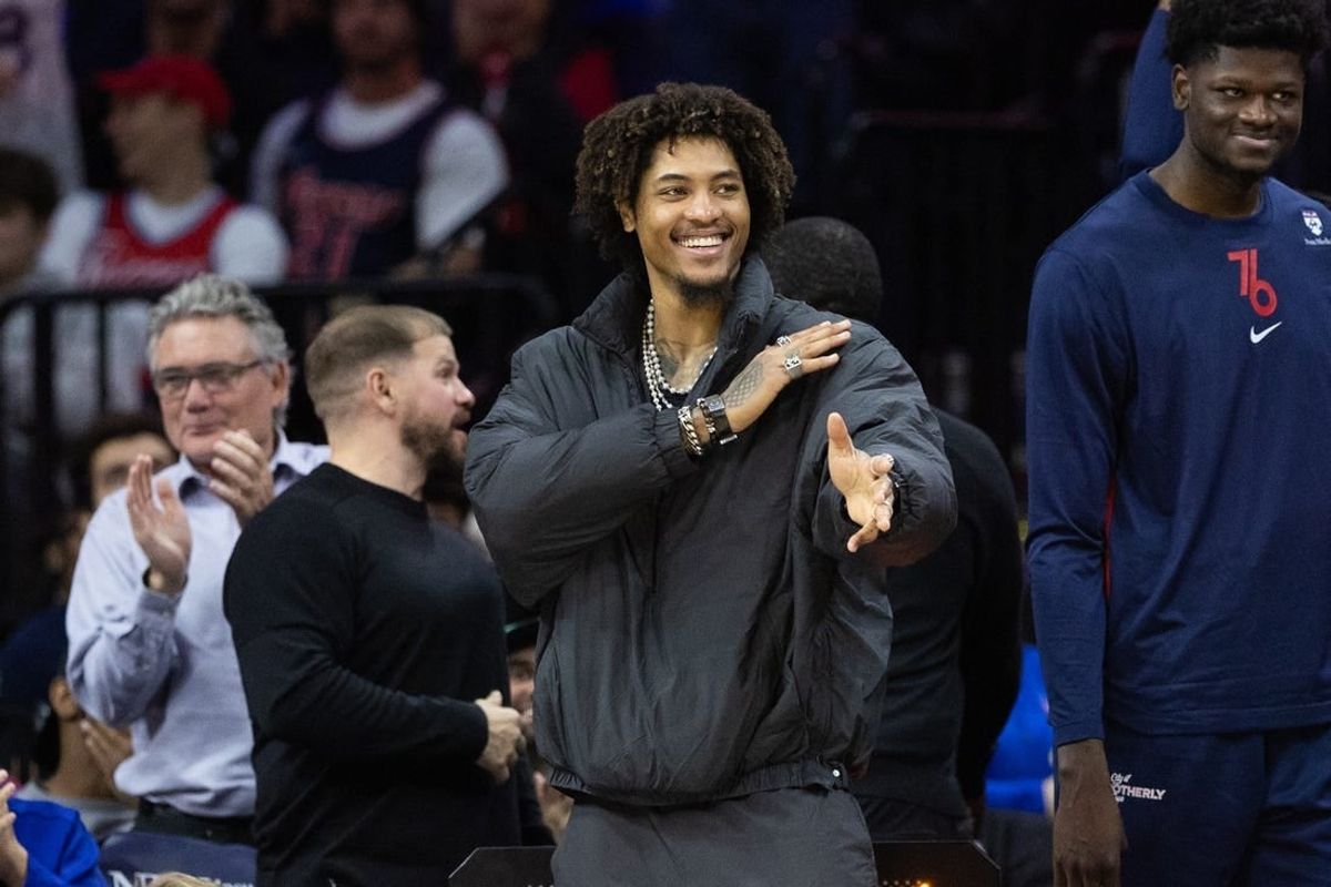 Nov 27, 2023; Philadelphia, Pennsylvania, USA; Philadelphia 76ers guard Kelly Oubre Jr. in street clothes reacts from the bench after a defensive stop against the Los Angeles Lakers during the third quarter at Wells Fargo Center.