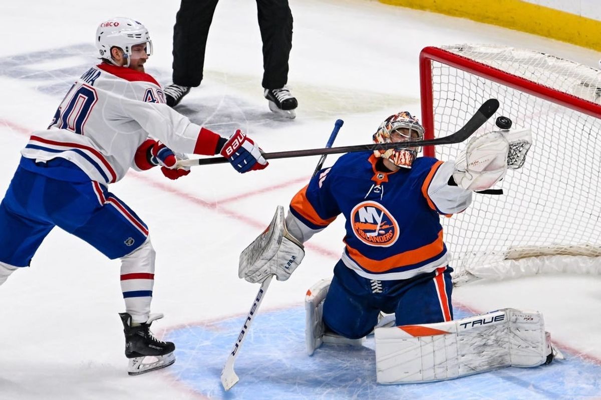 Apr 11, 2024; Elmont, New York, USA; New York Islanders goaltender Semyon Varlamov (40) makes a save on Montreal Canadiens right wing Joel Armia (40) during the second period at UBS Arena.