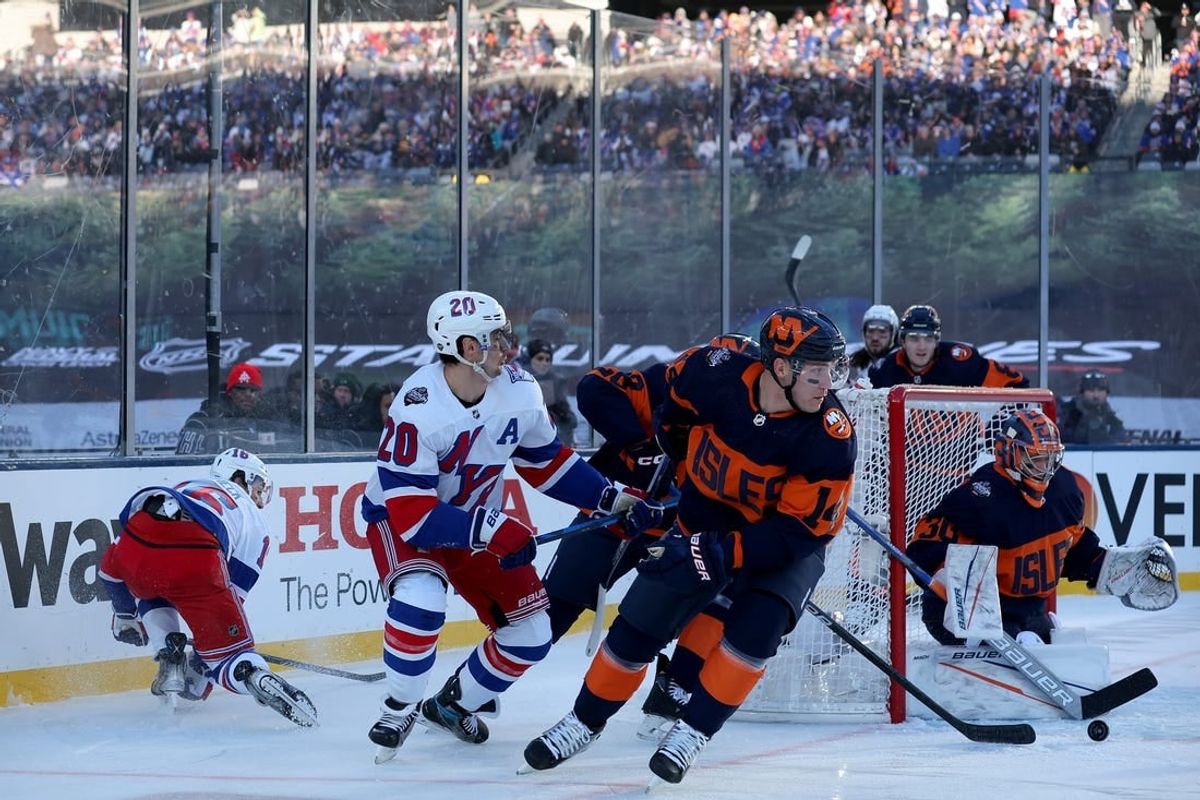 Feb 18, 2024; East Rutherford, New Jersey, USA; New York Islanders goaltender Ilya Sorokin (30) plays the puck against New York Rangers left wing Chris Kreider (20) during the first period of a Stadium Series ice hockey game at MetLife Stadium.