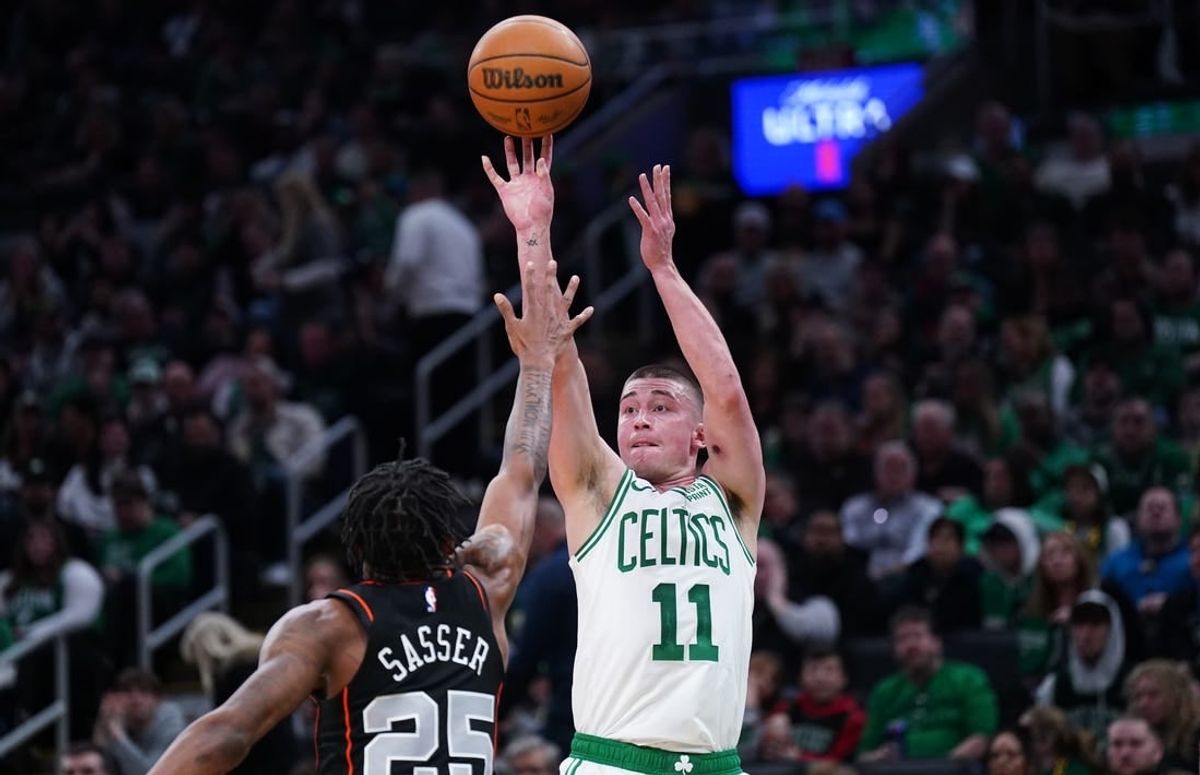 Mar 18, 2024; Boston, Massachusetts, USA; Boston Celtics guard Payton Pritchard (11) shoots the ball against Detroit Pistons guard Marcus Sasser (25) in the second quarter at TD Garden.