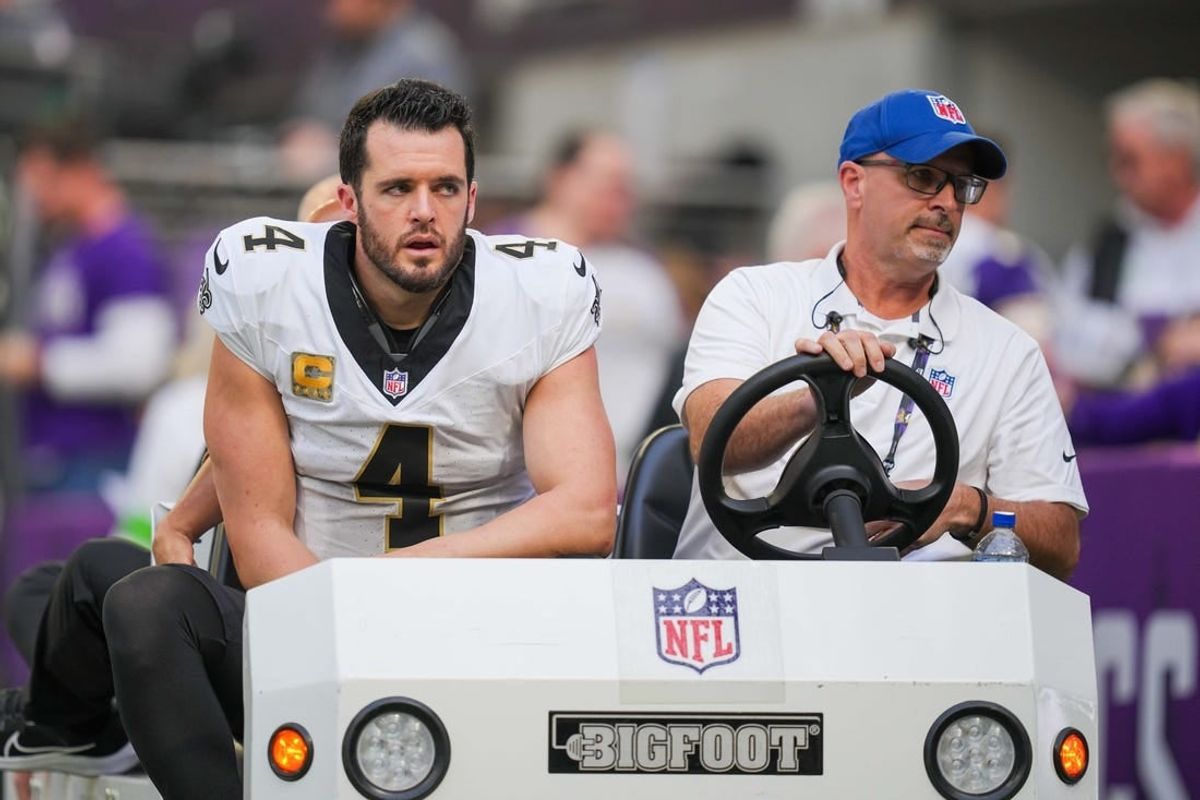 Nov 12, 2023; Minneapolis, Minnesota, USA; New Orleans Saints quarterback Derek Carr (4) is carted off the field against the Minnesota Vikings in the third quarter at U.S. Bank Stadium.