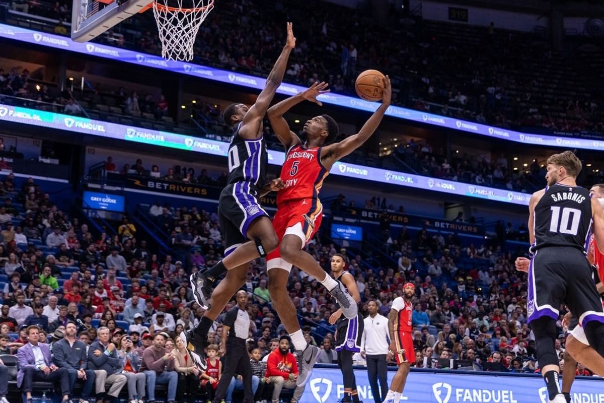 Nov 20, 2023; New Orleans, Louisiana, USA;  New Orleans Pelicans forward Herbert Jones (5) drives to the basket against Sacramento Kings forward Harrison Barnes (40) during the first half at the Smoothie King Center.