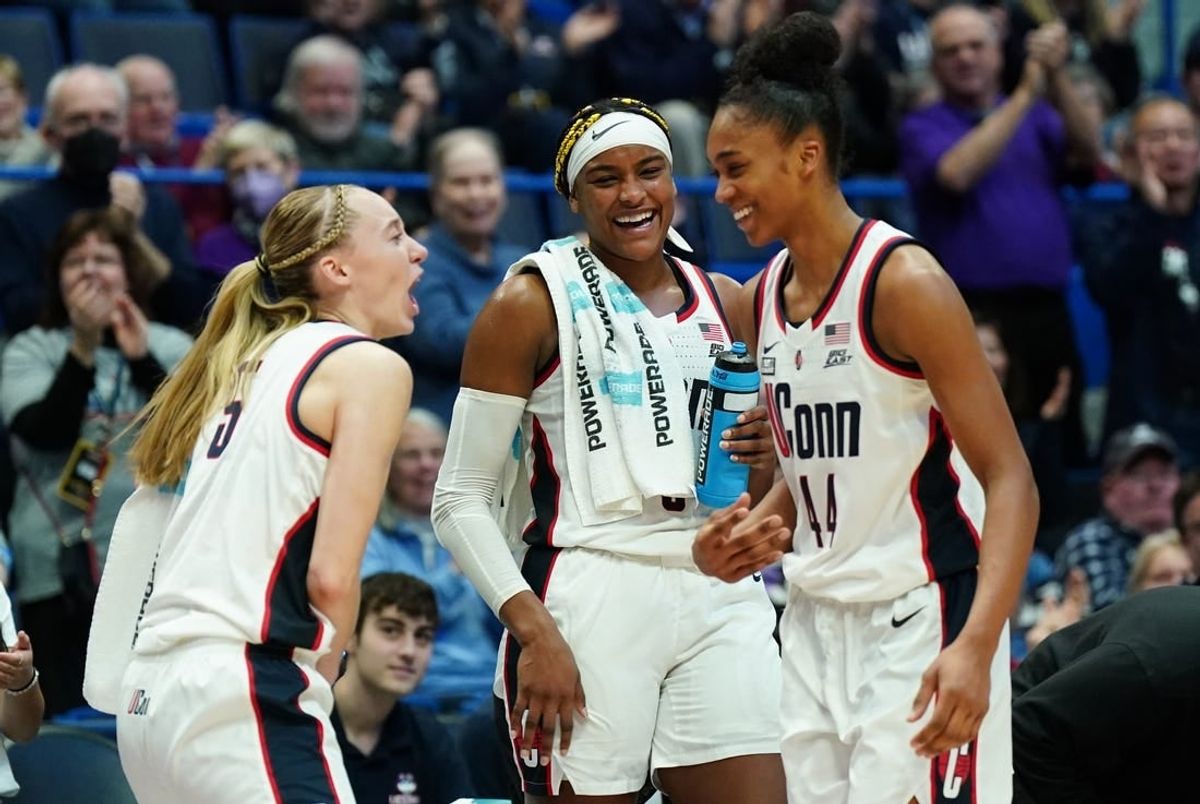 Dec 16, 2023; Hartford, Connecticut, USA; UConn Huskies guard Aubrey Griffin (44) is congratulated by guard Paige Bueckers (5) and forward Aaliyah Edwards (3) as she comes off the court as high scorer of the game against the Louisville Cardinals at XL Center.