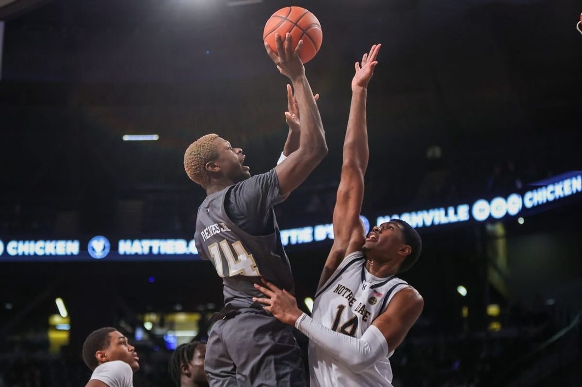 Jan 9, 2024; Atlanta, Georgia, USA; Georgia Tech Yellow Jackets guard Kowacie Reeves Jr. (14) shoots over Notre Dame Fighting Irish forward Kebba Njie (14) in the second half at McCamish Pavilion.