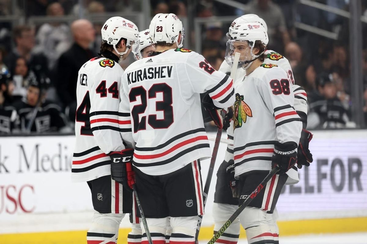 Mar 19, 2024; Los Angeles, California, USA;  Chicago Blackhawks defenseman Wyatt Kaiser (44) and center Philipp Kurashev (23) and center Connor Bedard (98) on the ice during the third period against the Los Angeles Kings at Crypto.com Arena.