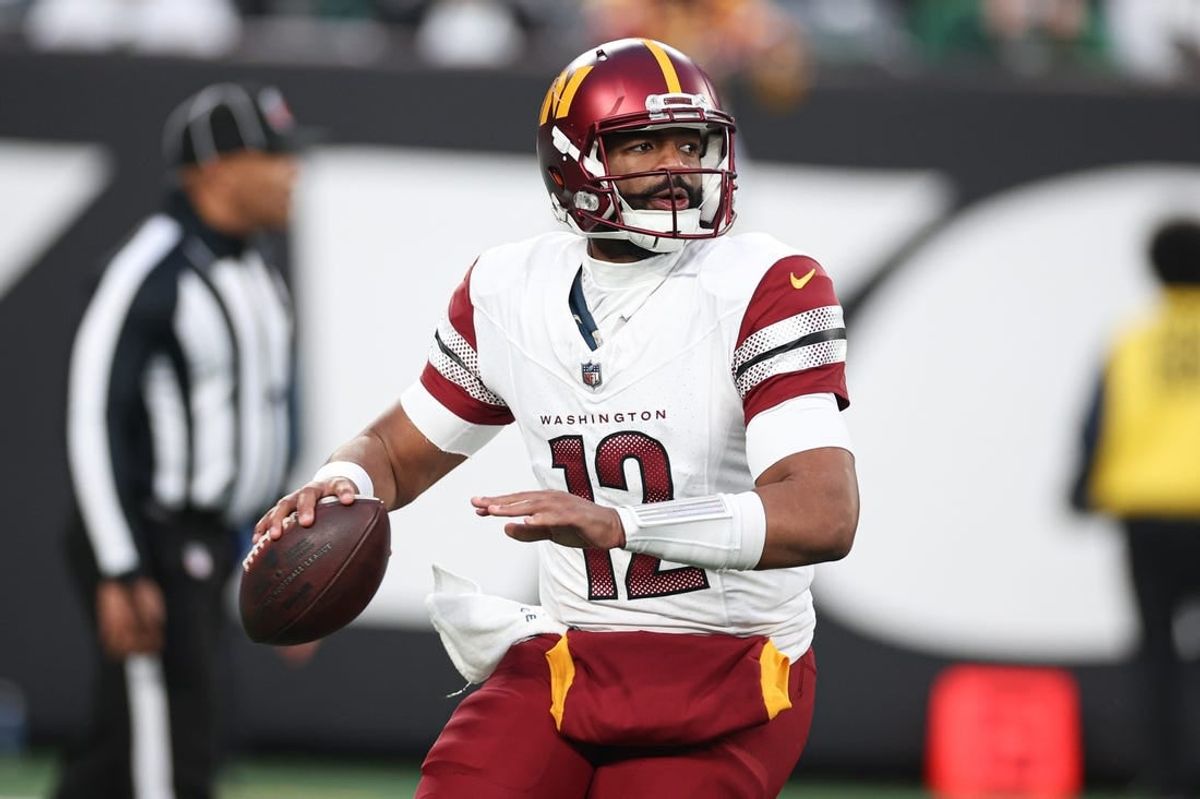 Dec 24, 2023; East Rutherford, New Jersey, USA; Washington Commanders quarterback Jacoby Brissett (12) throws the ball during the second half against the New York Jets at MetLife Stadium.