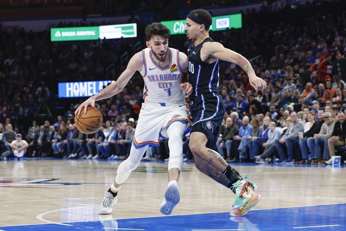 Jan 13, 2024; Oklahoma City, Oklahoma, USA; Oklahoma City Thunder forward Chet Holmgren (7) drives to the basket against Orlando Magic guard Cole Anthony (50) during the second half at Paycom Center.