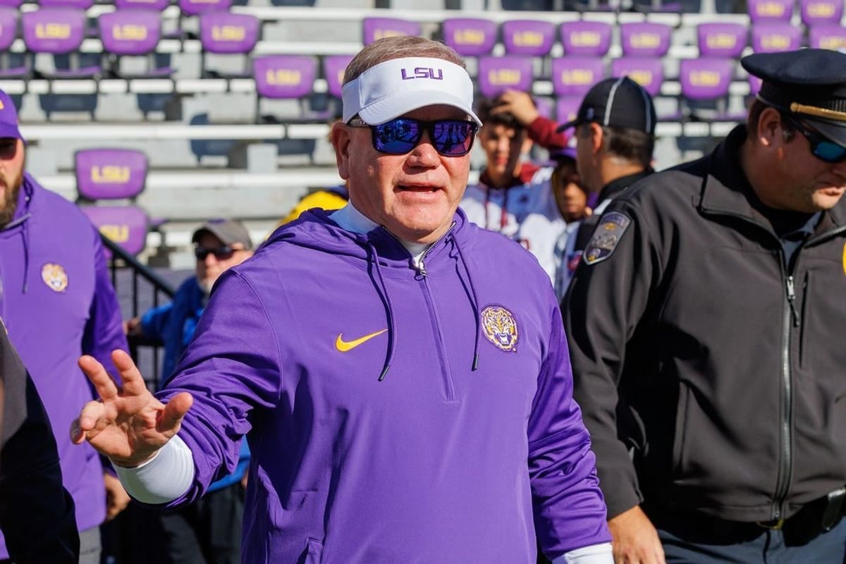 Nov 25, 2023; Baton Rouge, Louisiana, USA;  LSU Tigers head coach Brian Kelly waves to fans during warmups before the game against the Texas A&M Aggies at Tiger Stadium.