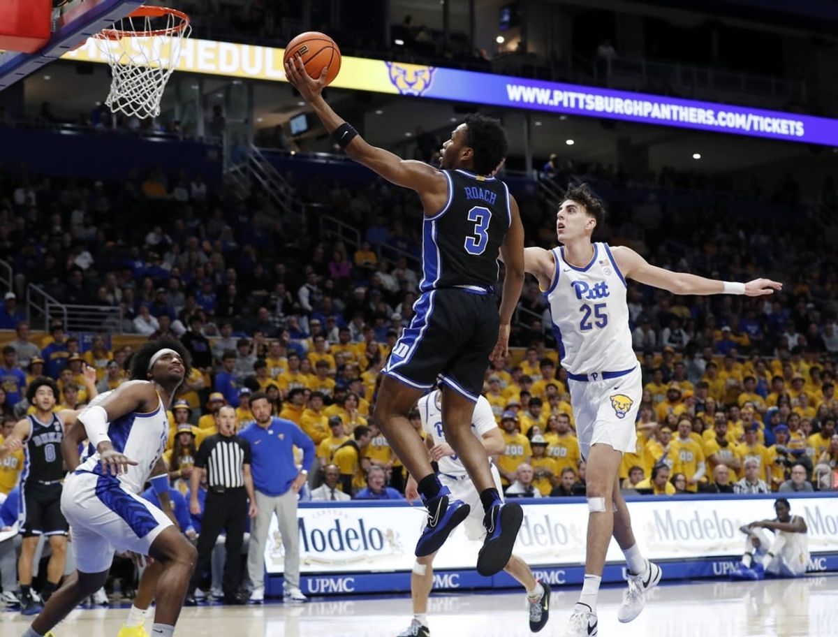 Jan 9, 2024; Pittsburgh, Pennsylvania, USA;  Duke Blue Devils guard Jeremy Roach (3) goes to the basket past Pittsburgh Panthers forward Guillermo Diaz Graham (25) during the first half at the Petersen Events Center.