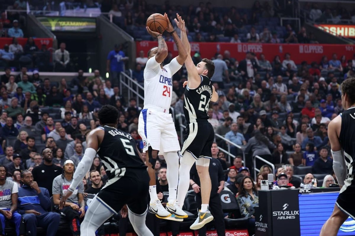 Mar 10, 2024; Los Angeles, California, USA;  Los Angeles Clippers guard Norman Powell (24) shoots the ball over Milwaukee Bucks guard Pat Connaughton (24) during the first quarter at Crypto.com Arena.