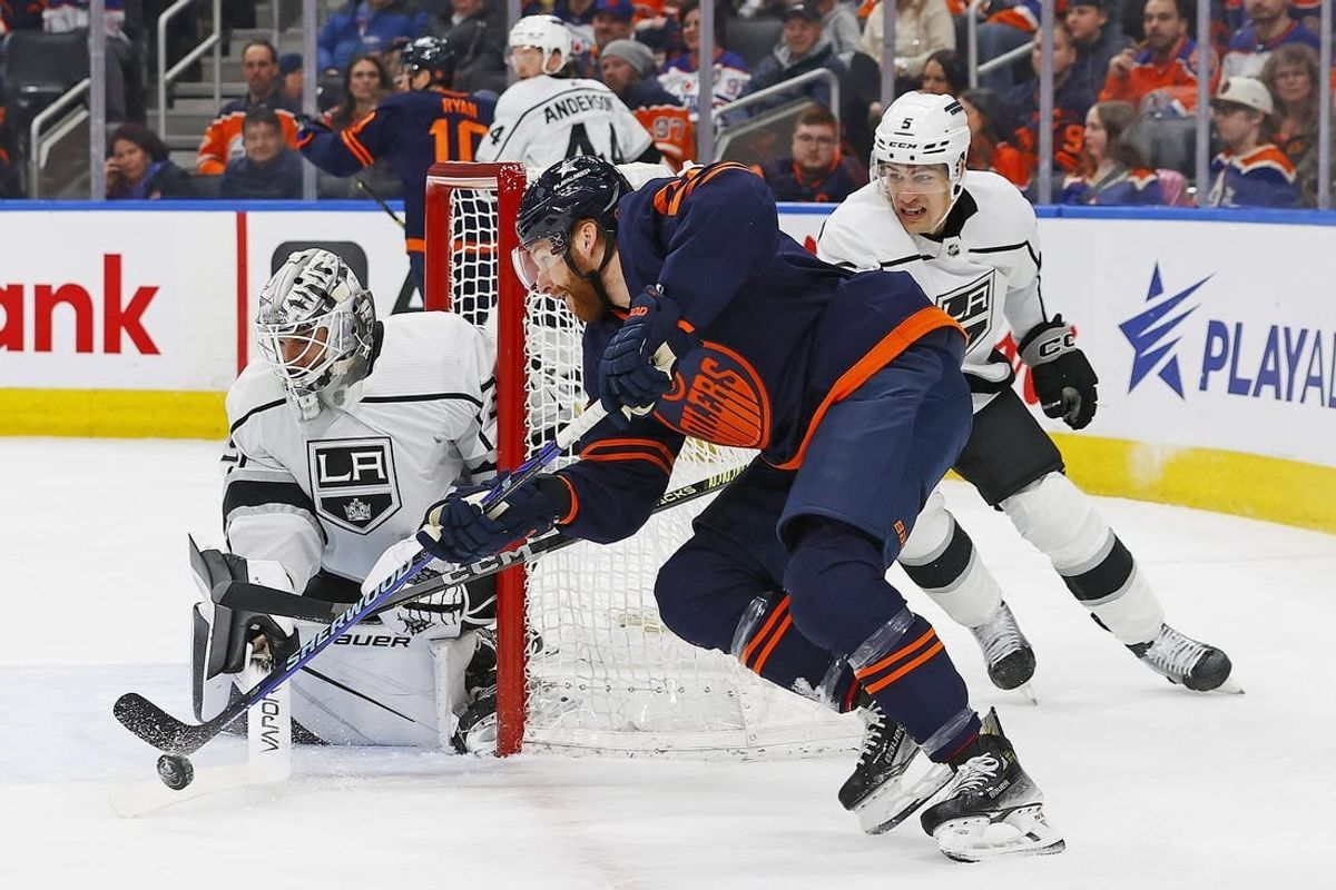 Mar 28, 2024; Edmonton, Alberta, CAN; Edmonton Oilers forward Connor Brown (28) tries to jam a puck past Los Angeles Kings goaltender Cam Talbot (39) during the first period at Rogers Place.