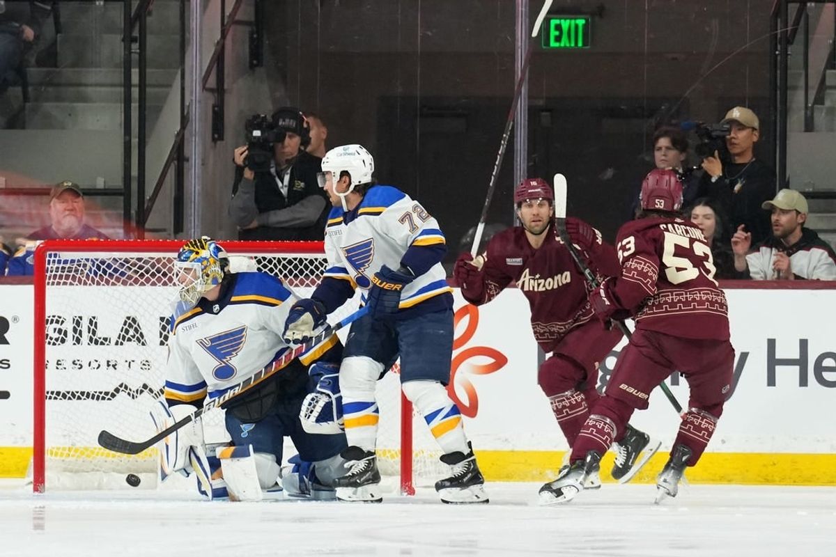 Dec 2, 2023; Tempe, Arizona, USA; Arizona Coyotes left wing Michael Carcone (53) scores against St. Louis Blues goaltender Joel Hofer (30) during the first period at Mullett Arena.