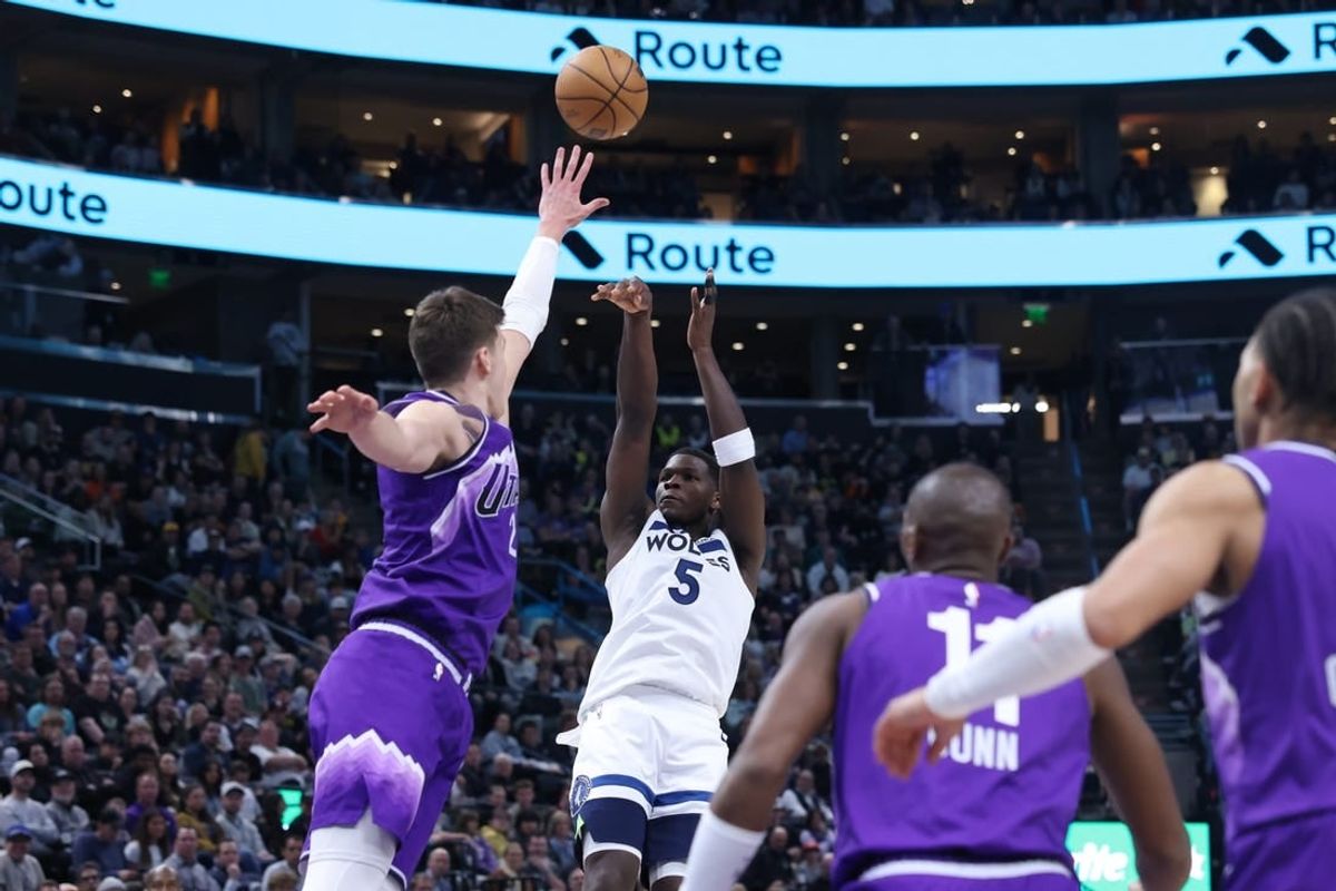 Mar 18, 2024; Salt Lake City, Utah, USA; Minnesota Timberwolves guard Anthony Edwards (5) shoots over Utah Jazz center Walker Kessler (24) during the fourth quarter at Delta Center.