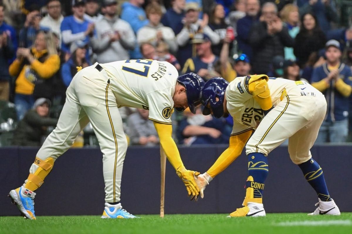 Apr 7, 2024; Milwaukee, Wisconsin, USA; Milwaukee Brewers catcher William Contreras (24) celebrates with shortstop Willy Adames (27) after hitting a two-run home run in the second inning against the Seattle Mariners at American Family Field.