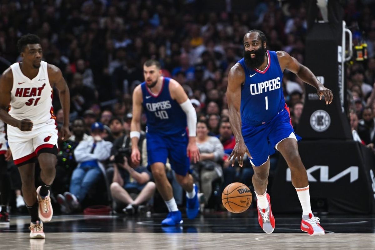 Jan 1, 2024; Los Angeles, California, USA; Los Angeles Clippers guard James Harden (1) moves the ball against Miami Heat center Thomas Bryant (31) during the second quarter at Crypto.com Arena.