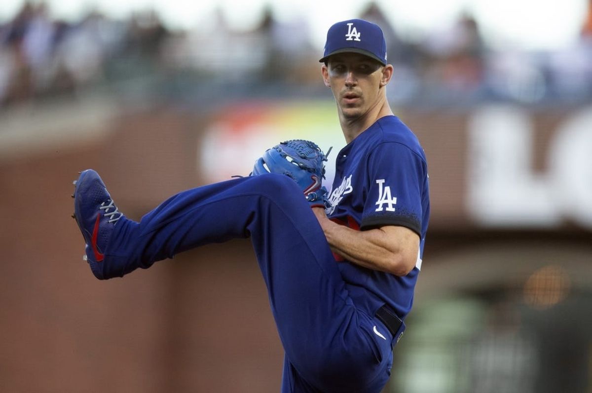 Jun 10, 2022; San Francisco, California, USA; Los Angeles Dodgers starting pitcher Walker Buehler (21) delivers a pitch against the San Francisco Giants during the second inning at Oracle Park.