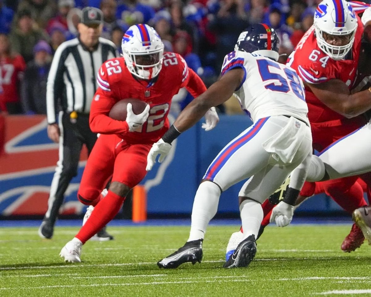 Oct 15, 2023; Orchard Park, New York, USA; New York Giants linebacker Bobby Okereke (58) tackles Buffalo Bills running back Damien Harris (22) during the first half at Highmark Stadium.