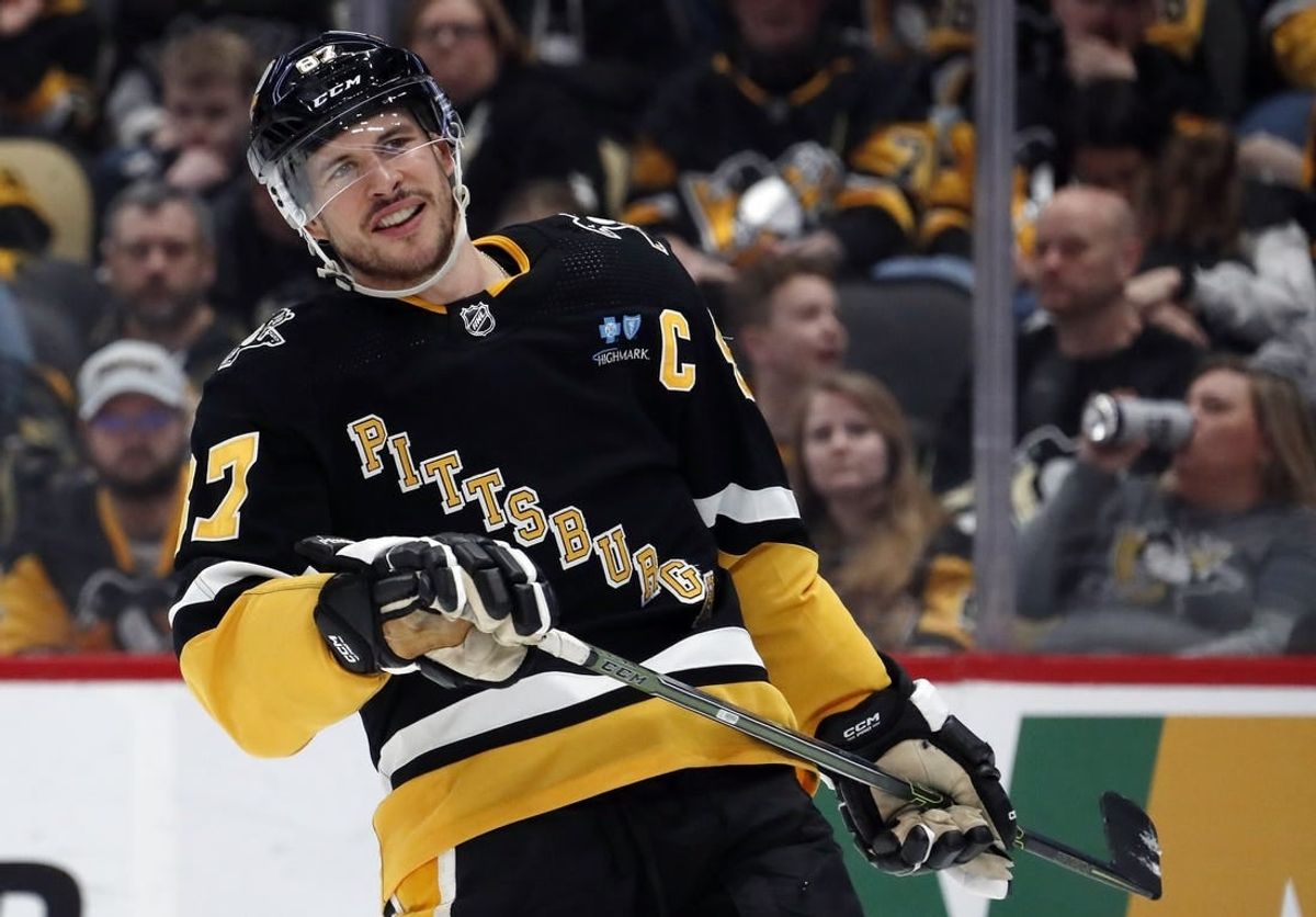 Mar 28, 2024; Pittsburgh, Pennsylvania, USA;  Pittsburgh Penguins center Sidney Crosby (87) reacts on the ice against the Columbus Blue Jackets during the third period at PPG Paints Arena. The Penguins won 3-2.