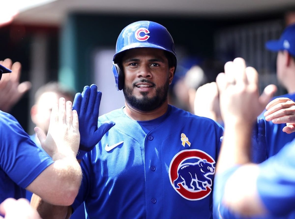 Sep 3, 2023; Cincinnati, Ohio, USA; Chicago Cubs third baseman Jeimer Candelario (9) reacts in the dugout after scoring against the Cincinnati Reds during the eighth inning at Great American Ball Park.