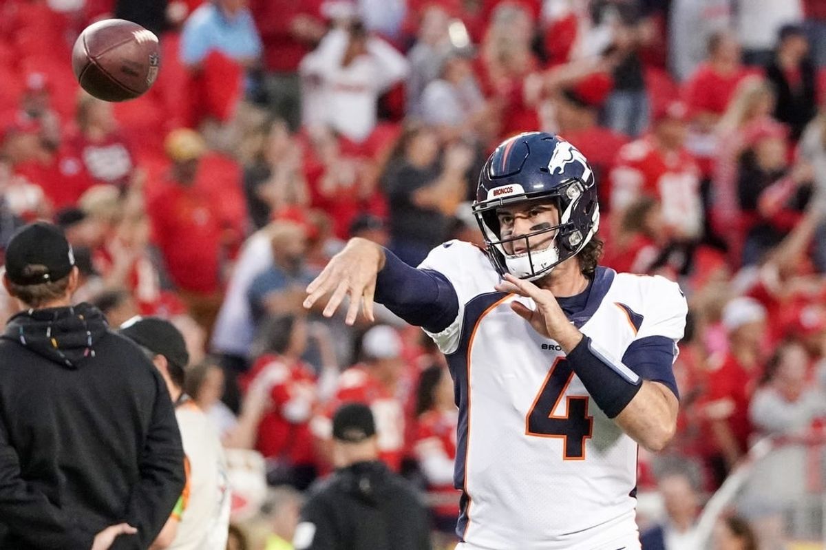 Oct 12, 2023; Kansas City, Missouri, USA; Denver Broncos quarterback Jarrett Stidham (4) warms up against the Kansas City Chiefs prior to a game at GEHA Field at Arrowhead Stadium.