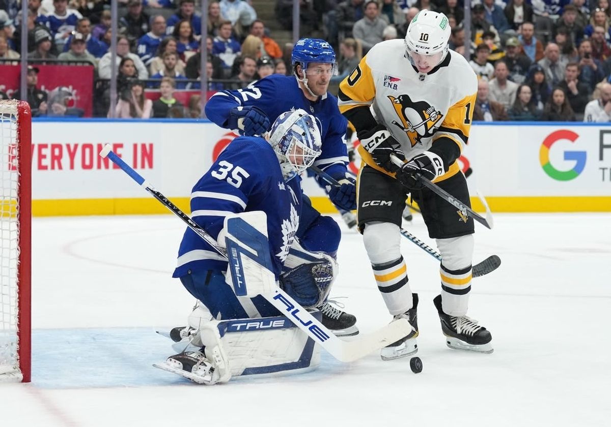 Apr 8, 2024; Toronto, Ontario, CAN; Pittsburgh Penguins left wing Drew O'Connor (10) battles for the puck with Toronto Maple Leafs defenseman Jake McCabe (22) in front of goaltender Ilya Samsonov (35) during the second period at Scotiabank Arena.