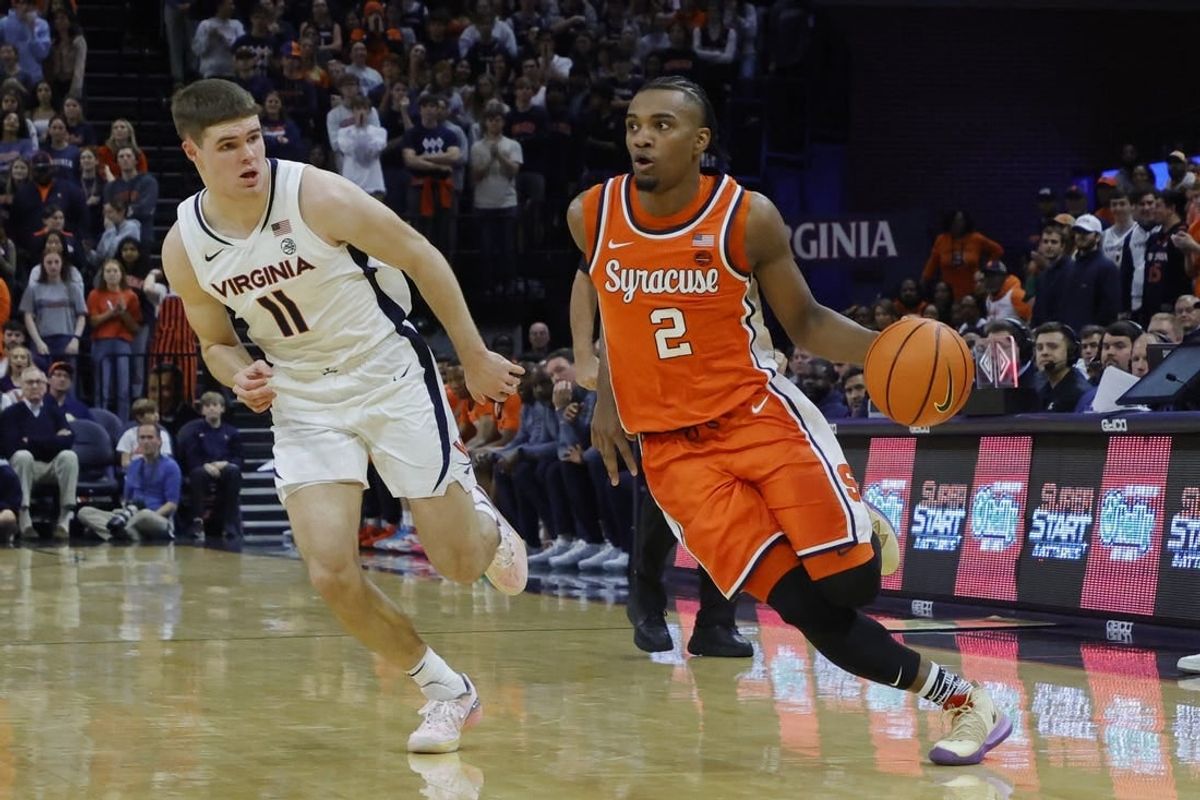 Dec 2, 2023; Charlottesville, Virginia, USA; Syracuse Orange guard JJ Starling (2) drives to the basket as Virginia Cavaliers guard Isaac McKneely (11) defends during the first half at John Paul Jones Arena.