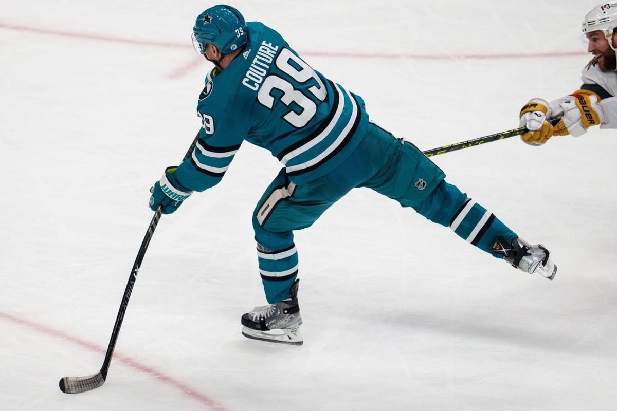 Mar 30, 2023; San Jose, California, USA;  San Jose Sharks center Logan Couture (39) during overtime scores the winning goal against the Vegas Golden Knights at SAP Center at San Jose.