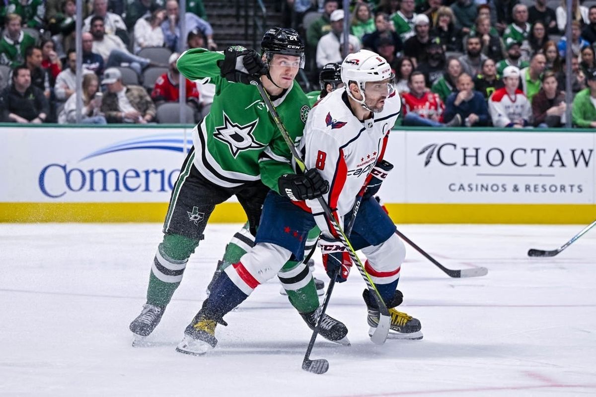 Oct 27, 2022; Dallas, Texas, USA; Dallas Stars center Roope Hintz (24) and Washington Capitals left wing Alex Ovechkin (8) in action during the game between the Dallas Stars and the Washington Capitals at the American Airlines Center.