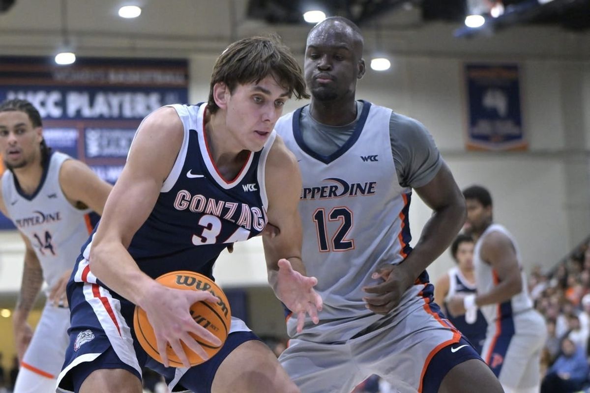 Jan 18, 2024; Malibu, California, USA; Gonzaga Bulldogs guard Luka Krajnovic (3) is defended by Pepperdine Waves forward Boubacar Coulibaly (12) in the first half at Firestone Fieldhouse.