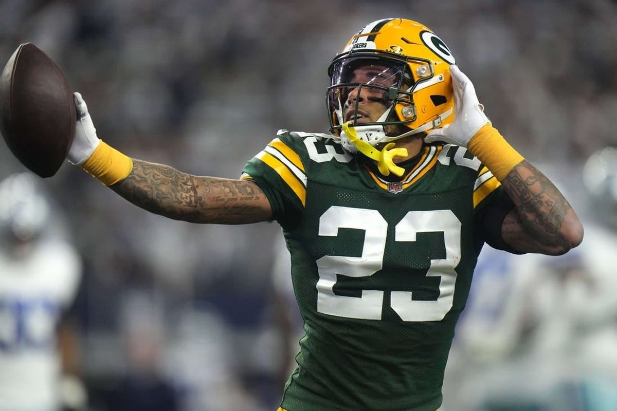 Jan 14, 2024; Arlington, Texas, USA; Green Bay Packers cornerback Jaire Alexander (23) reacts after intercepting a pass during the first quarter of the wild card playoff game against the Dallas Cowboys Sunday, January 14, 2024 at AT&T Stadium in Arlington, Texas.