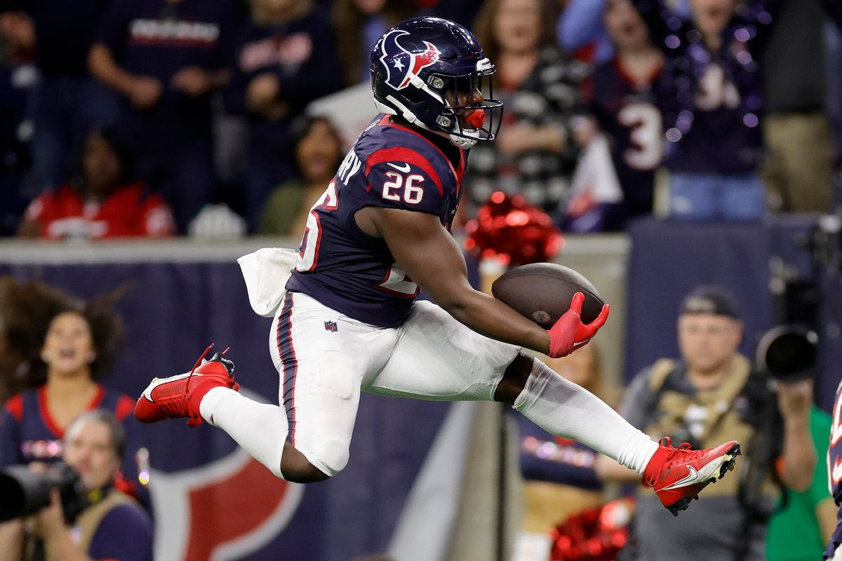 Devin Singletary of the Houston Texans scores a 19-yard touchdown against the Cleveland Browns during the fourth quarter in the AFC Wild Card Playoffs at NRG Stadium.