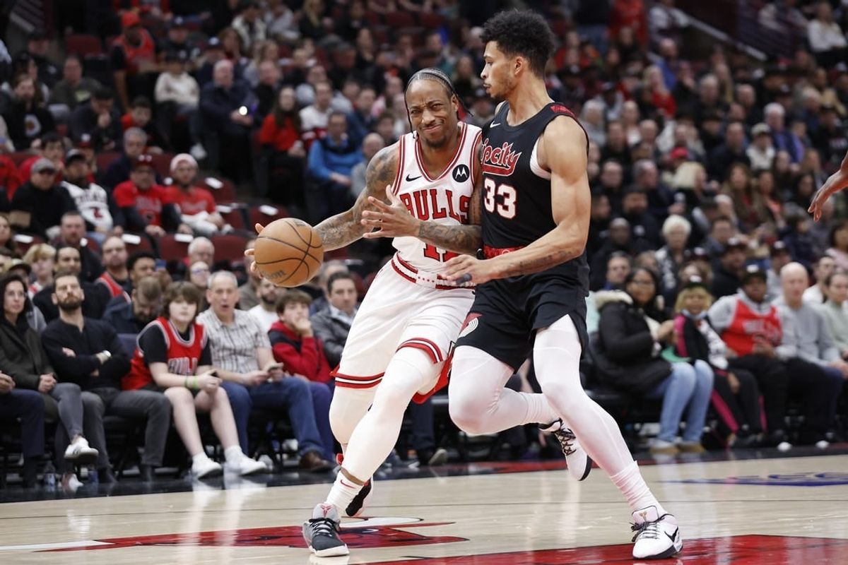 Mar 18, 2024; Chicago, Illinois, USA; Chicago Bulls forward DeMar DeRozan (11) drives to the basket against Portland Trail Blazers forward Toumani Camara (33) during the first half at United Center.