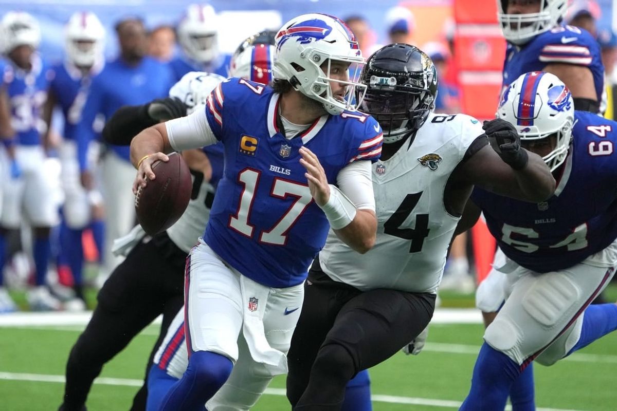Oct 8, 2023; London United Kingdom, Buffalo Bills quarterback Josh Allen (17)] throws the ball under pressure from Jacksonville Jaguars defensive tackle Folorunso Fatukasi (94) during the first half of an NFL International Series game at Tottenham Hotspur Stadium.