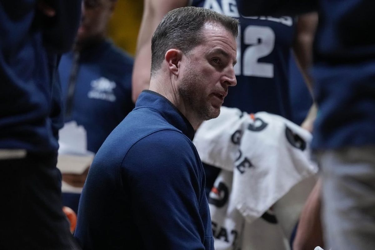 Feb 14, 2024; Laramie, Wyoming, USA; Utah State Aggies head coach Danny Sprinkle draws up a play against the Wyoming Cowboys during the second half at Arena-Auditorium.
