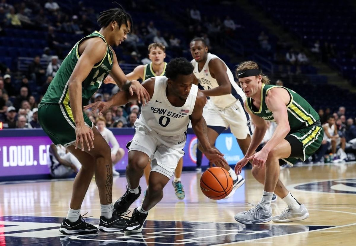 Dec 21, 2023; University Park, Pennsylvania, USA; Penn State Nittany Lions guard Kanye Clary (0) tries to maintain control of the ball during the first half against the Le Moyne Dolphins at Bryce Jordan Center. Penn State defeated Le Moyne 72-55.