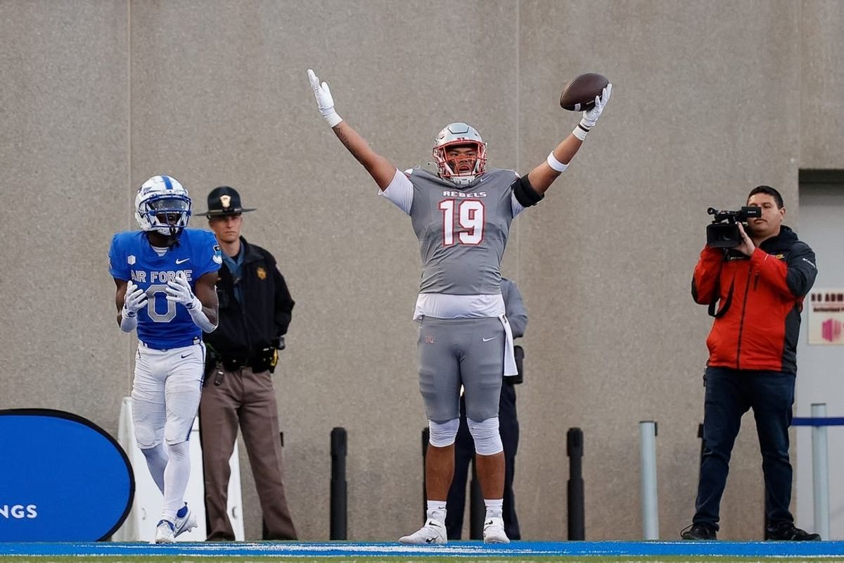 UNLV Rebels tight end Kaleo Ballungay (19) reacts after his touchdown against Air Force Falcons defensive back Trey Williams (0) in the third quarter at Falcon Stadium.