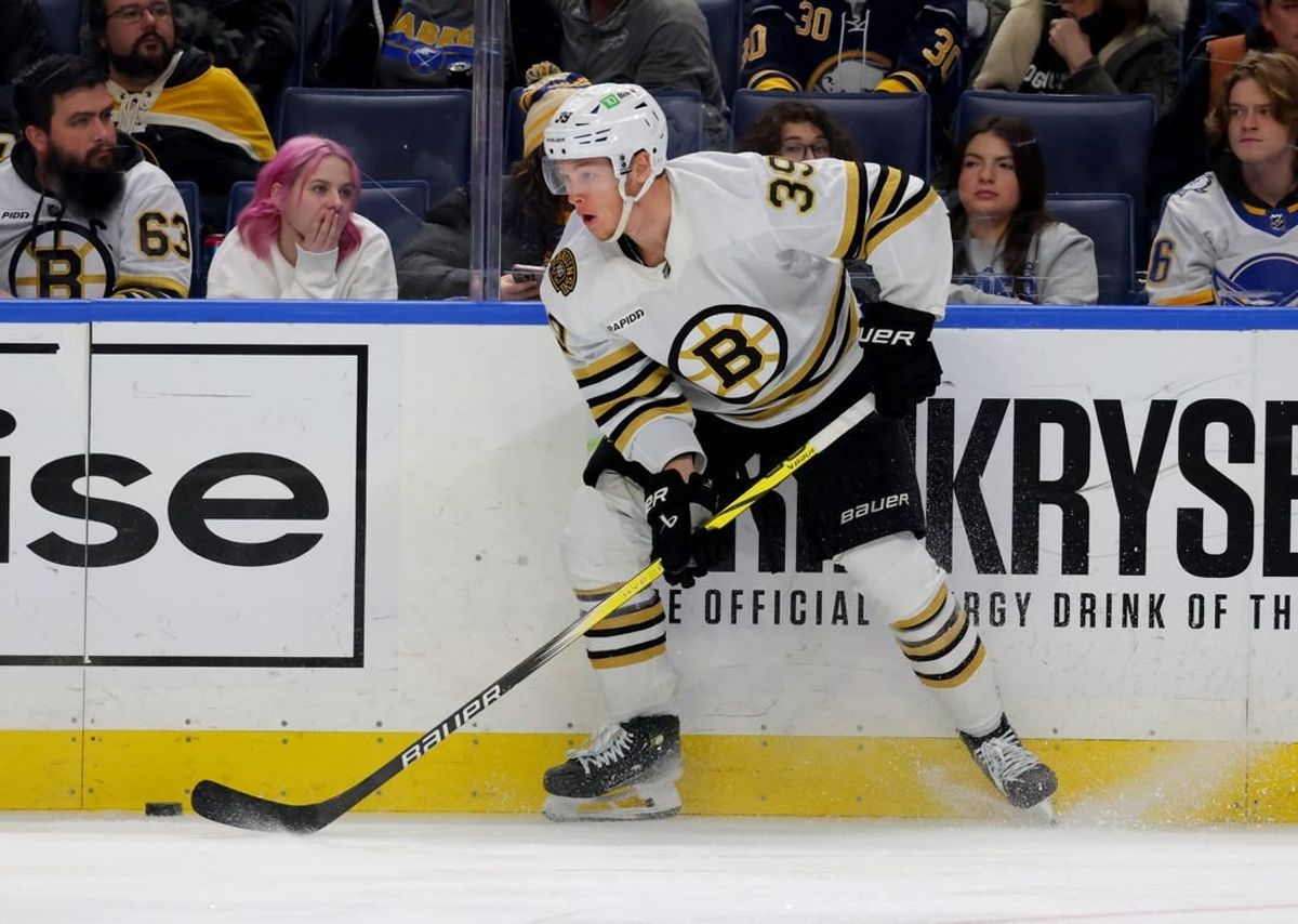 Dec 27, 2023; Buffalo, New York, USA;  Boston Bruins center Morgan Geekie (39) looks to make a pass during the third period against the Buffalo Sabres at KeyBank Center.