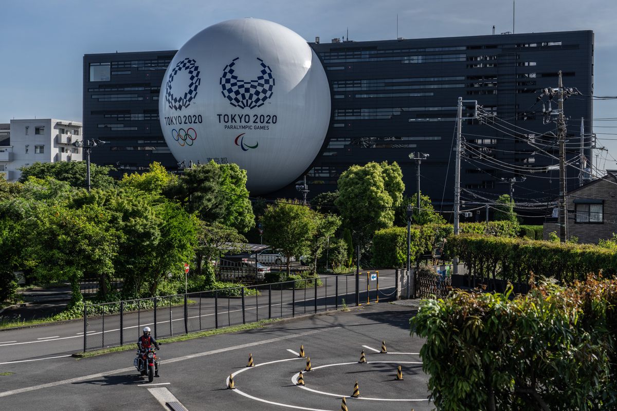 The Tokyo Olympics and Paralympics logos are on display  even as the city’s governor is considering extending a state of emergency.