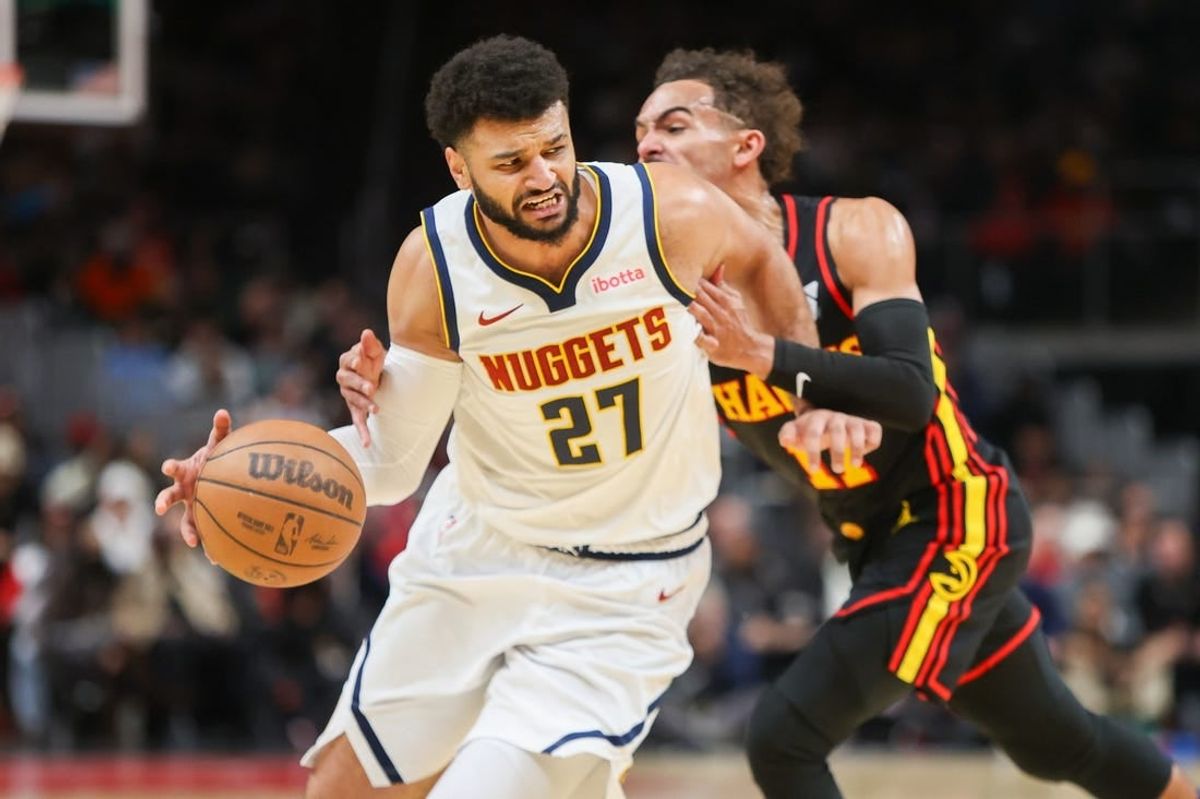 Dec 11, 2023; Atlanta, Georgia, USA; Denver Nuggets guard Jamal Murray (27) is fouled by Atlanta Hawks guard Trae Young (11) in the second quarter at State Farm Arena.