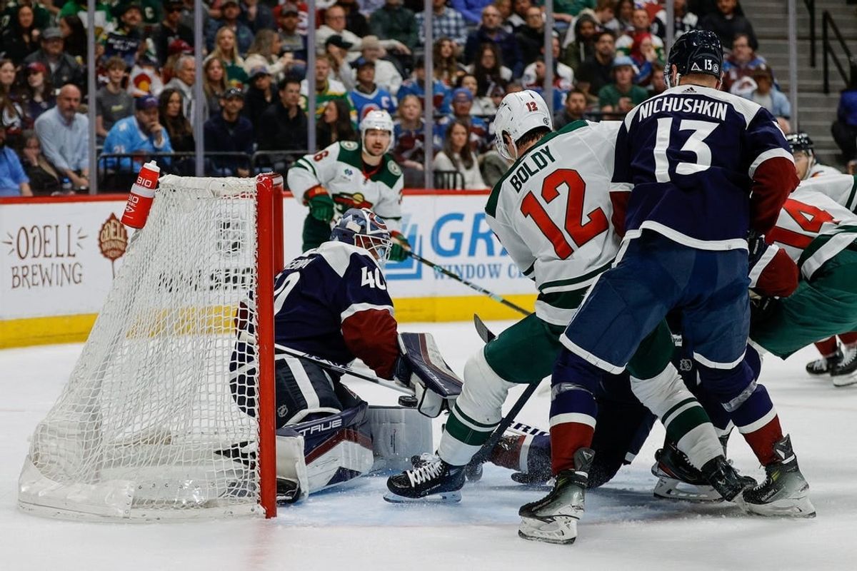 Apr 9, 2024; Denver, Colorado, USA; Minnesota Wild left wing Matt Boldy (12) scores a goal past Colorado Avalanche goaltender Alexandar Georgiev (40) as right wing Valeri Nichushkin (13) defends in the second period at Ball Arena.