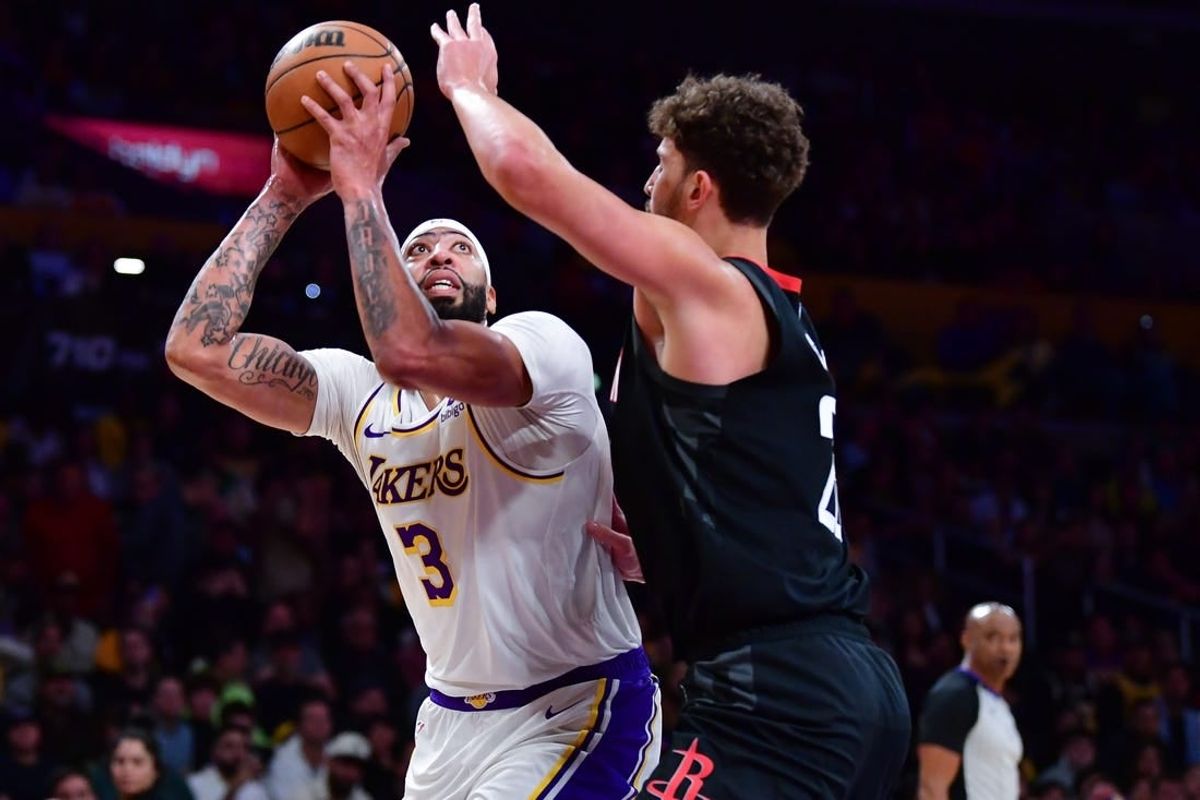 Dec 2, 2023; Los Angeles, California, USA; Los Angeles Lakers forward Anthony Davis (3) moves to the basket against Houston Rockets center Alperen Sengun (28) during the first half at Crypto.com Arena.