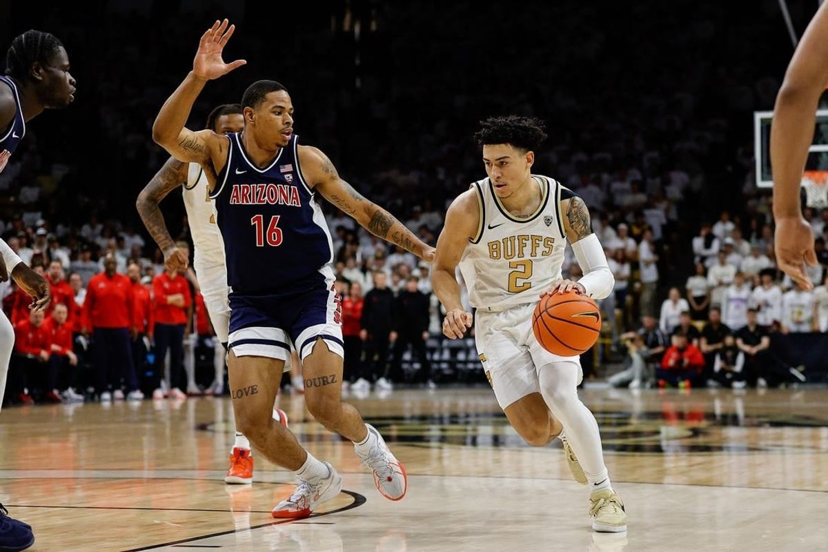 Feb 10, 2024; Boulder, Colorado, USA; Colorado Buffaloes guard KJ Simpson (2) controls the ball against Arizona Wildcats forward Keshad Johnson (16) in the second half at CU Events Center.